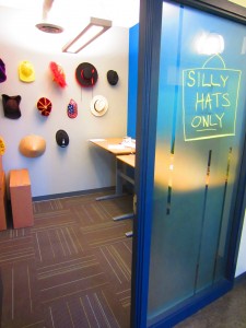 Shopify's hat room, as seen from outside, with the "Silly Hats Only!" sign outside