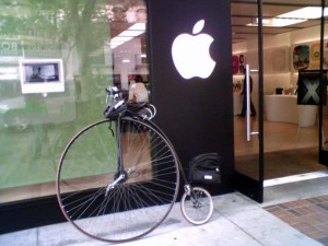 Penny-farting bicycle parked outside the Apple Store