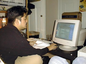 Joey deVilla (circa 1998) working away on a desktop PC