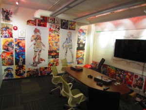 Shopify's videogame room, as seen from the door, with anime posters adorning the walls