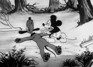 Still from Disney cartoon: Mickey weeping over an apparently dead Pluto's body.