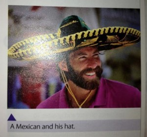 Photo from a textbook showing a WASPy student in a novelty sombrero, captioned "A Mexican and his hat"