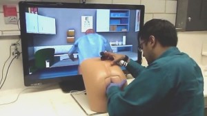 Doctor using butt-shaped interface for a prostate exam simulator