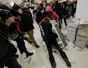 Two shoppers fighting over a TV set in Wembley, UK.