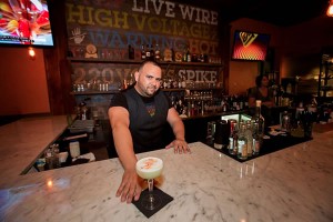 Photo: Bartender Ryan Pines at the edison food + drink lab's bar serving a Fire from Lima.