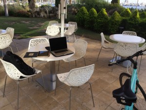 Joey deVilla's computer and bike at the outdoor cafe at the Salvador Dali Museum