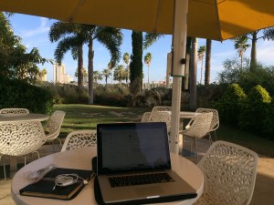 Joey deVilla's computer and bike at the outdoor cafe at the Salvador Dali Museum