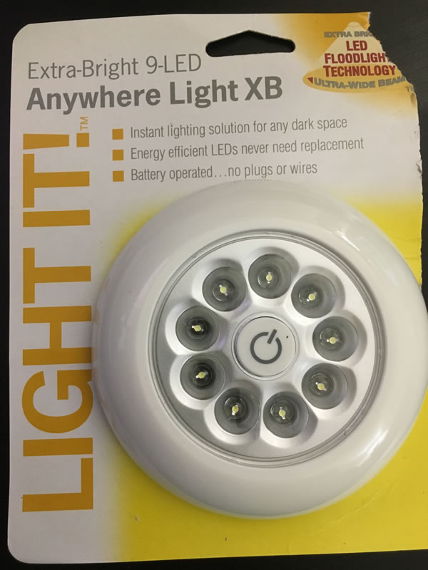 Our "Light It!" brand 9-led hand lamp, with its packaging.