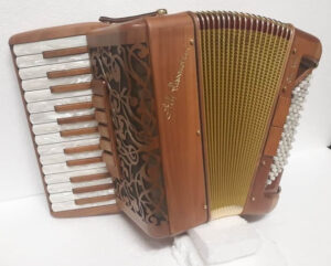Photo: An Alessandrini Celt accordion, whose body is made entirely out of wood.