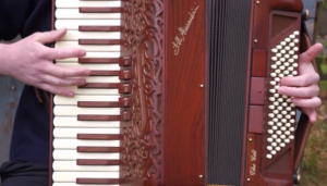 Photo: Still from video -- Close-up of piano keys and bellows on Alessandrini Celt.