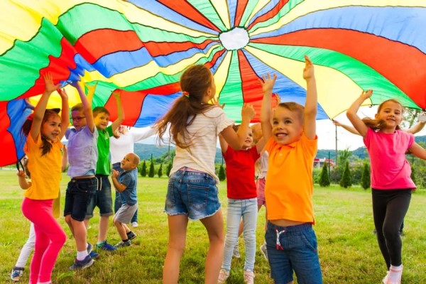 Children playing with a parachute