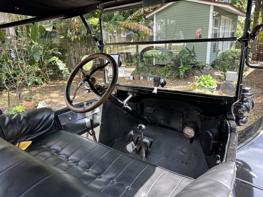 Interior of the 1916 Ford Model T, showing the dashboard and front seat.